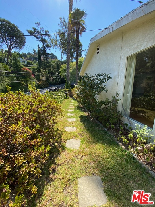 9748 Oak Pass Road Beverly Hills, CA 90210 - Photo 18 of 20 a view of swimming pool from a yard