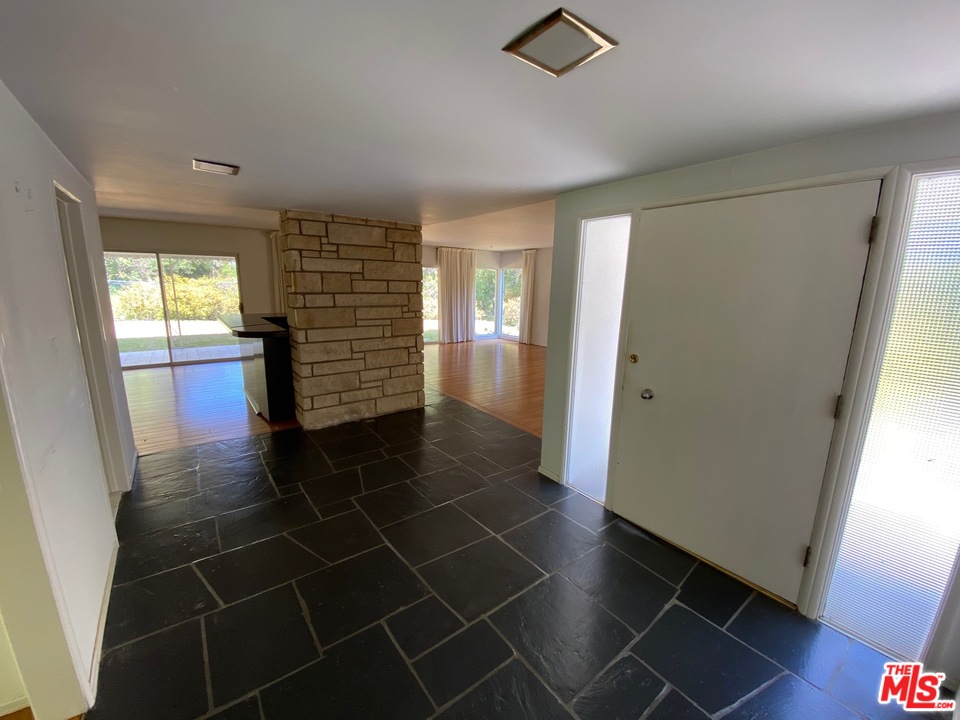 9748 Oak Pass Road Beverly Hills, CA 90210 - Photo 4 of 20 a view of an empty room with a window