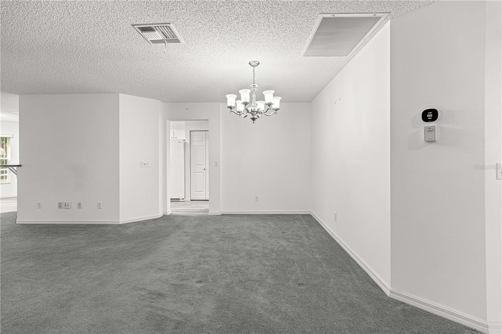 9614 Southwest 93rd Loop Ocala, FL 34481 - Photo 13 of 45 a view of a chandelier in big room and chandelier