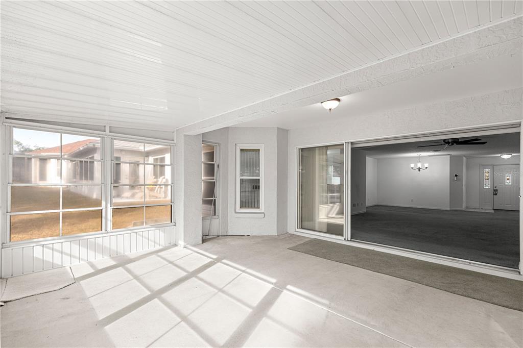 9614 Southwest 93rd Loop Ocala, FL 34481 - Photo 17 of 45 an empty room with entrance and windows