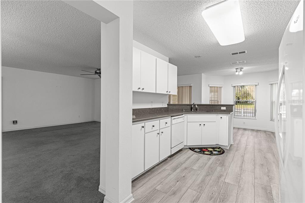9614 Southwest 93rd Loop Ocala, FL 34481 - Photo 22 of 45 a kitchen with white cabinets and appliances