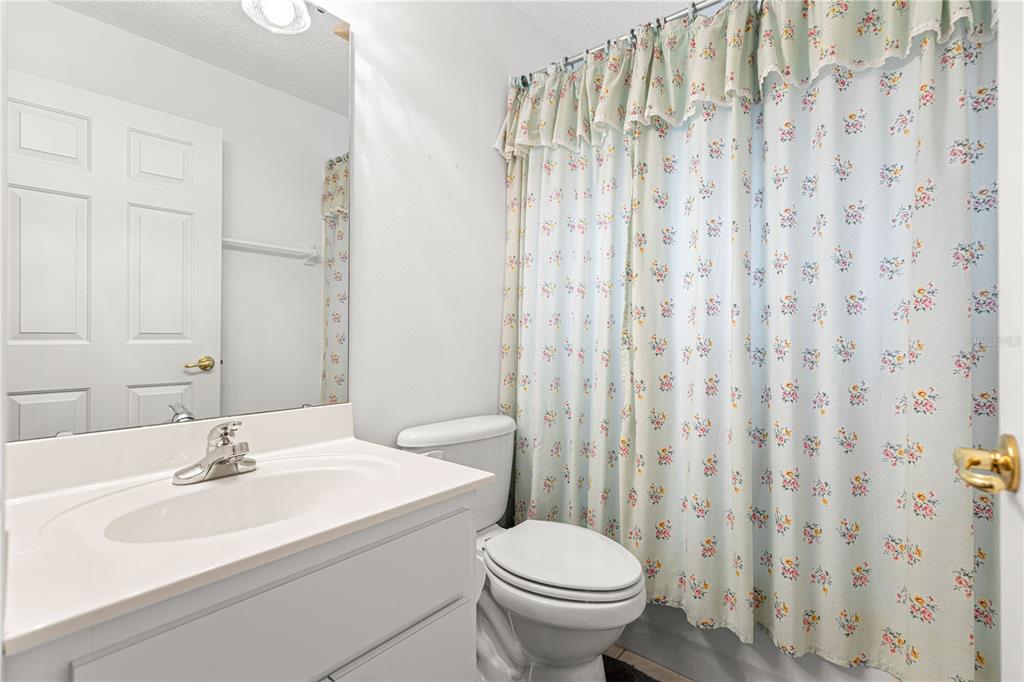 9614 Southwest 93rd Loop Ocala, FL 34481 - Photo 35 of 45 a bathroom with a sink a toilet and a mirror