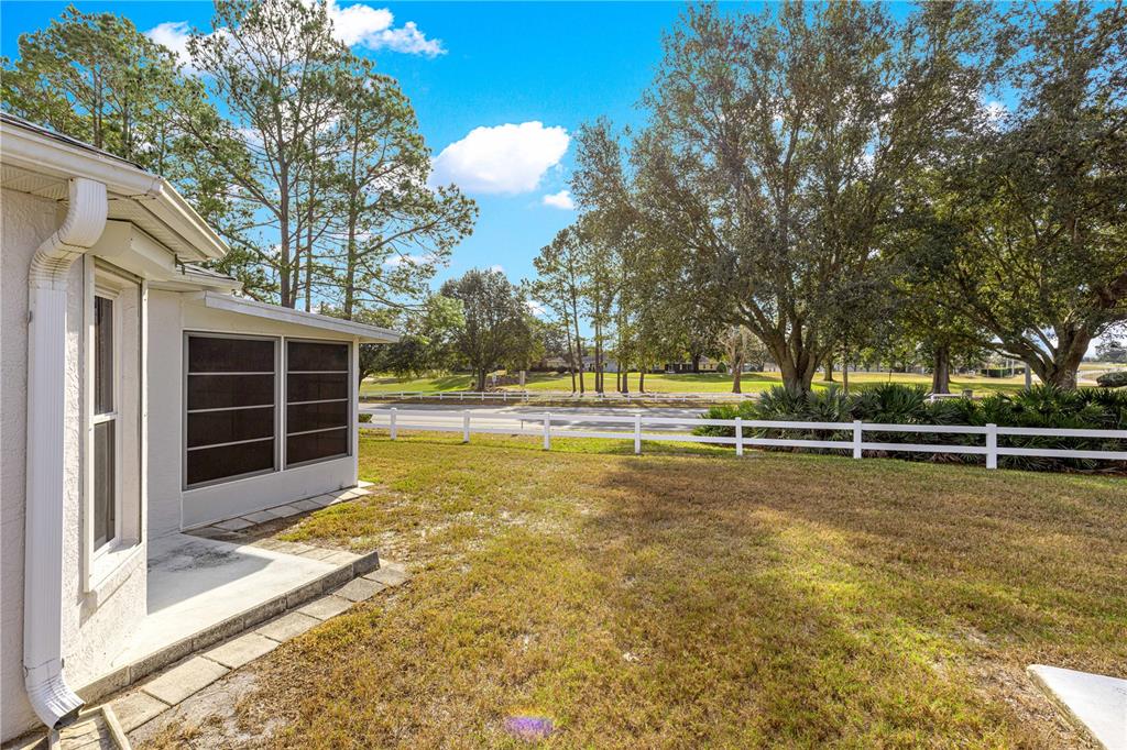 9614 Southwest 93rd Loop Ocala, FL 34481 - Photo 38 of 45 a view of a swimming pool with an outdoor space and seating area