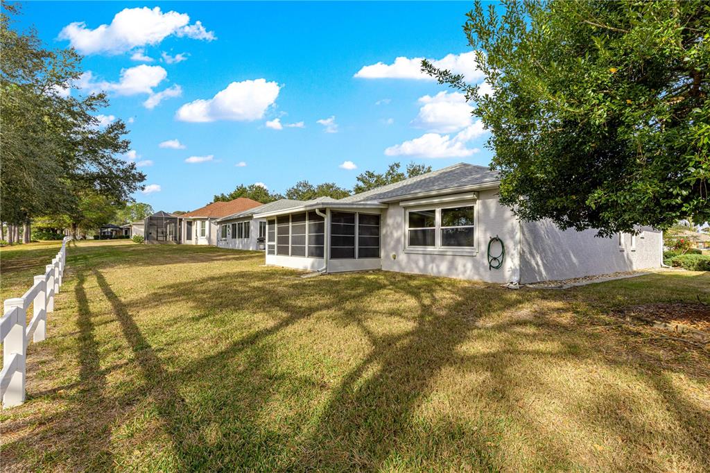 9614 Southwest 93rd Loop Ocala, FL 34481 - Photo 41 of 45 a view of a house with a yard