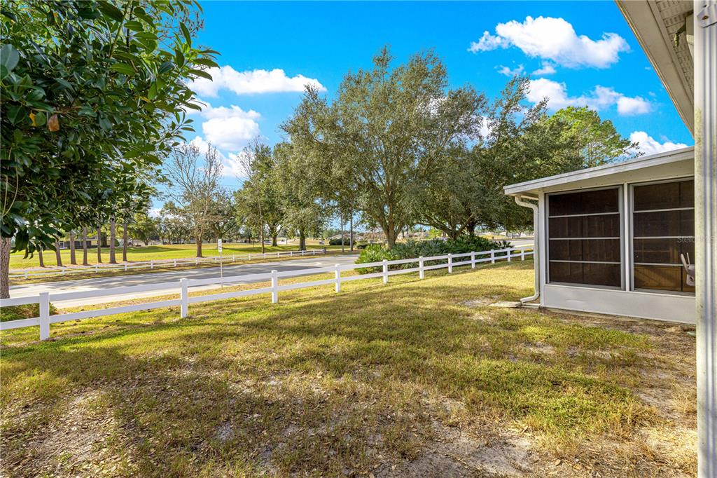 9614 Southwest 93rd Loop Ocala, FL 34481 - Photo 42 of 45 a view of a swimming pool with an outdoor space and seating area