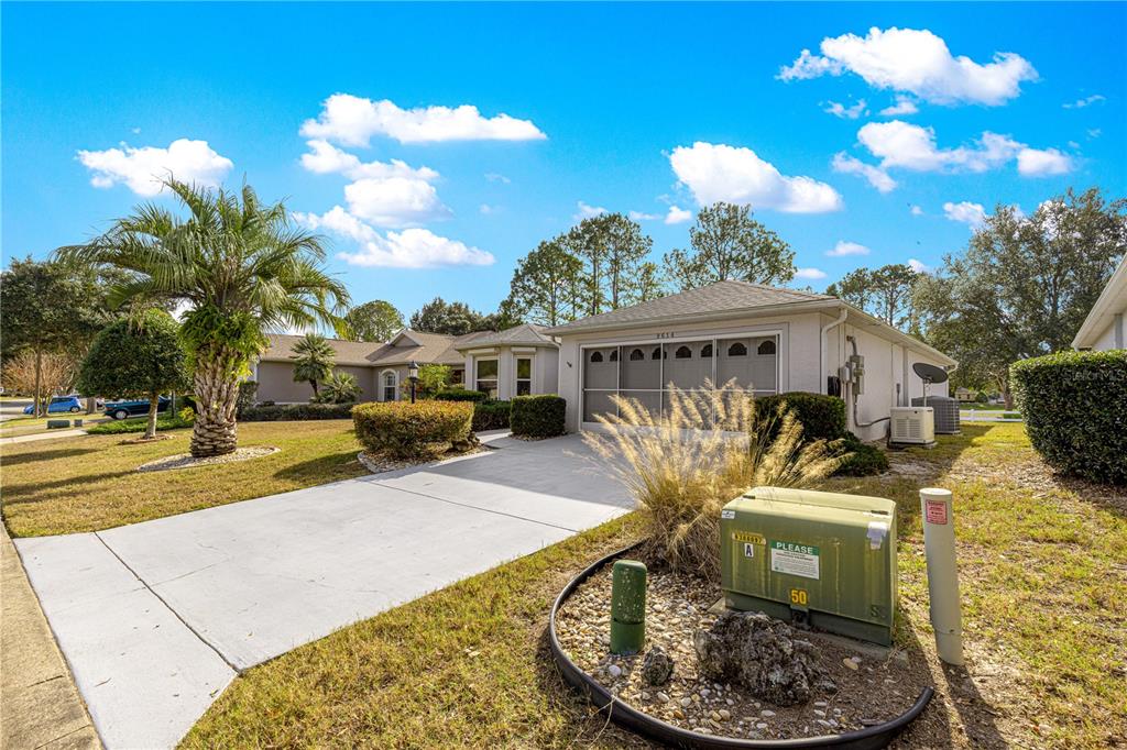 9614 Southwest 93rd Loop Ocala, FL 34481 - Photo 43 of 45 a view of a house with backyard water fountain and sitting area