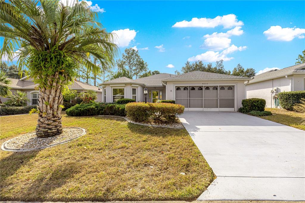 9614 Southwest 93rd Loop Ocala, FL 34481 - Photo 44 of 45 a front view of a house with a yard