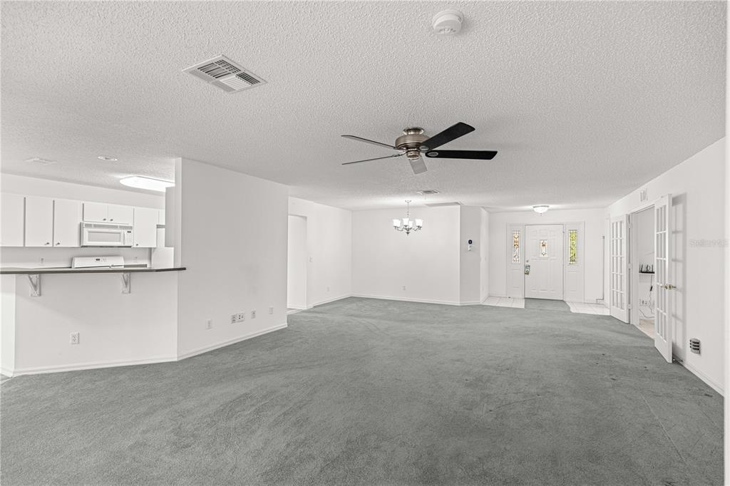 9614 Southwest 93rd Loop Ocala, FL 34481 - Photo 9 of 45 a view of an empty room and kitchen view