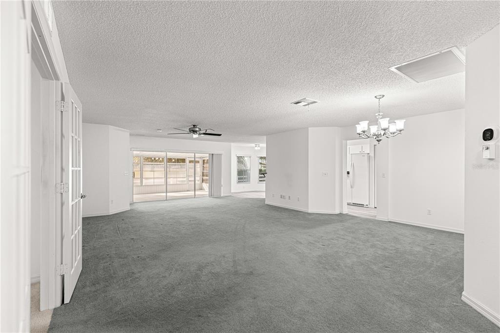 9614 Southwest 93rd Loop Ocala, FL 34481 - Photo 10 of 45 an empty room with windows and cabinet