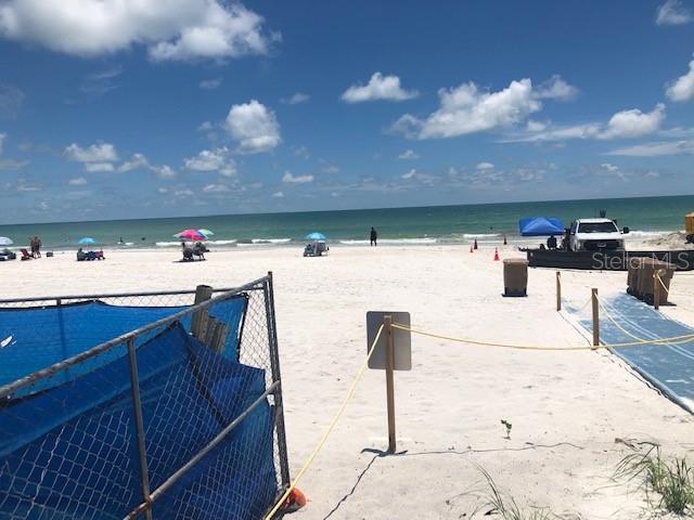 14048 Gulf Boulevard, Unit 402 Madeira Beach, FL 33708 - Photo 13 of 16 a kitchen with a sink and a stove