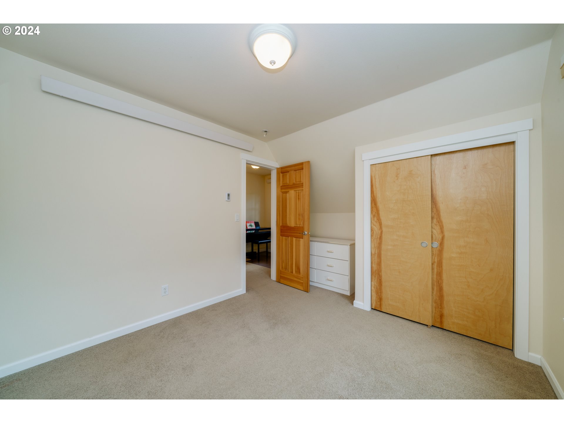 9355 Dewolf Road Nehalem, OR 97131 - Photo 18 of 33 a view of an empty room with wooden floor