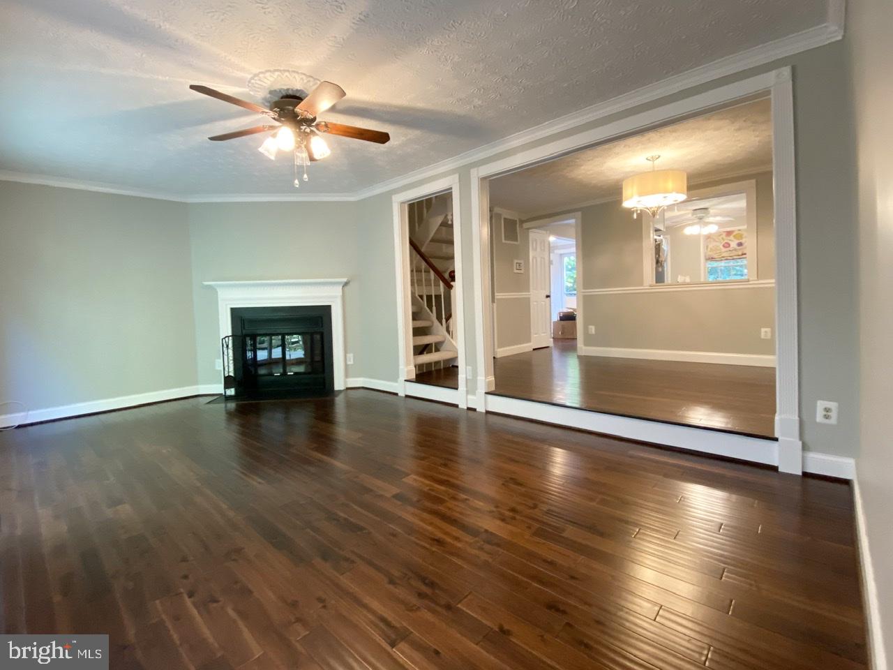 10964 Harpers Square Court Reston, VA 20191 - Photo 13 of 34 Sunken living room with wood-burning fireplace