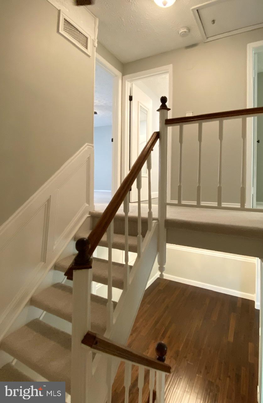 10964 Harpers Square Court Reston, VA 20191 - Photo 15 of 34 From the landing between main and upper levels