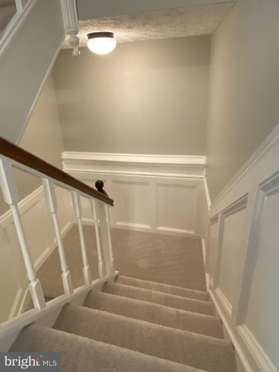 10964 Harpers Square Court Reston, VA 20191 - Photo 25 of 34 To the lower level--notice elegant woodworking.