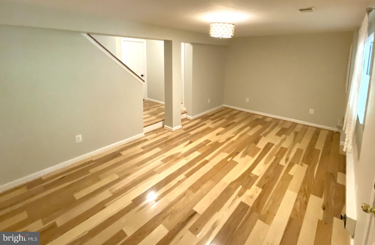 10964 Harpers Square Court Reston, VA 20191 - Photo 28 of 34 Basement family room; walkout door is on the right