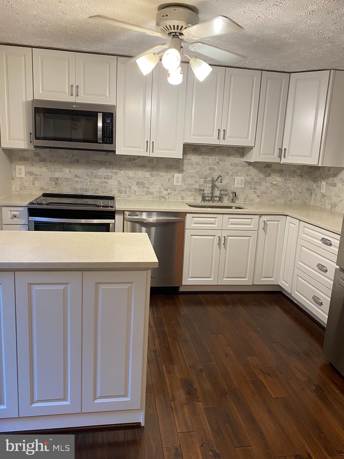 10964 Harpers Square Court Reston, VA 20191 - Photo 8 of 34 Baking/serving Island provides extra storage