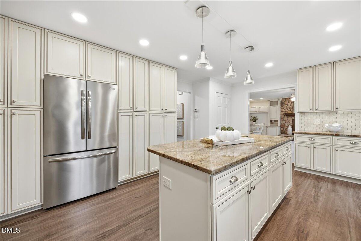1603 Green Pine Court Raleigh, NC 27614 - Photo 11 of 70 a kitchen with a refrigerator a sink and cabinets
