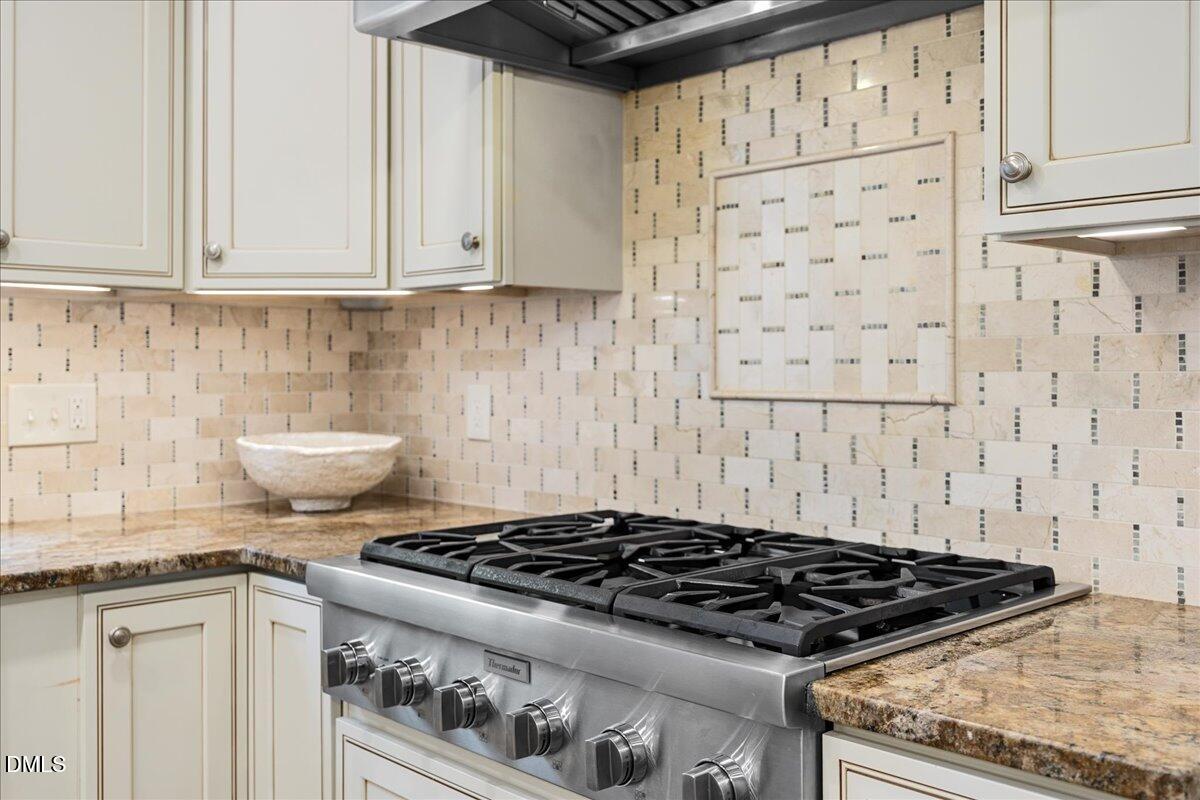 1603 Green Pine Court Raleigh, NC 27614 - Photo 12 of 70 a stove top oven sitting inside of a kitchen