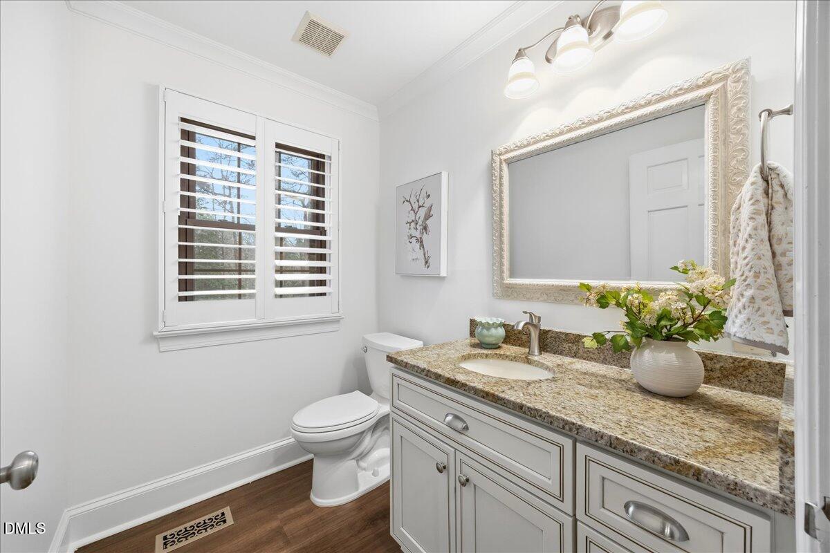 1603 Green Pine Court Raleigh, NC 27614 - Photo 17 of 70 a bathroom with a granite countertop sink toilet and mirror