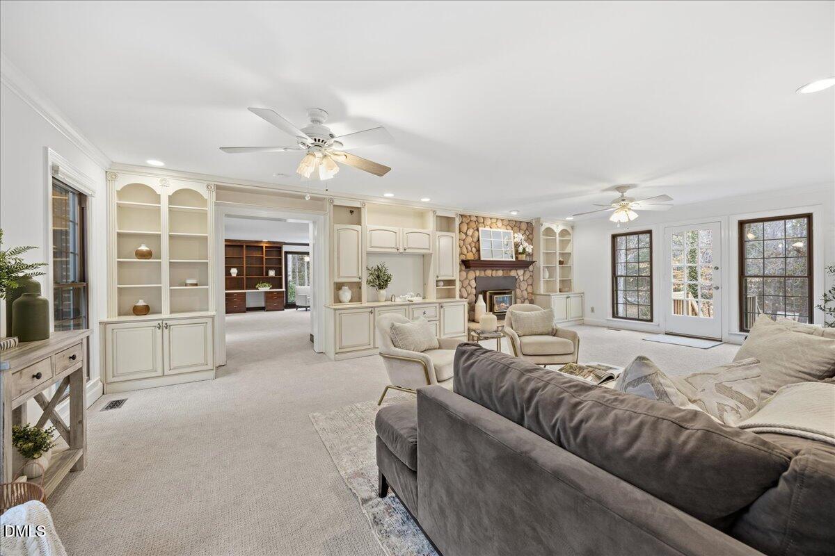 1603 Green Pine Court Raleigh, NC 27614 - Photo 25 of 70 a living room with furniture and a flat screen tv