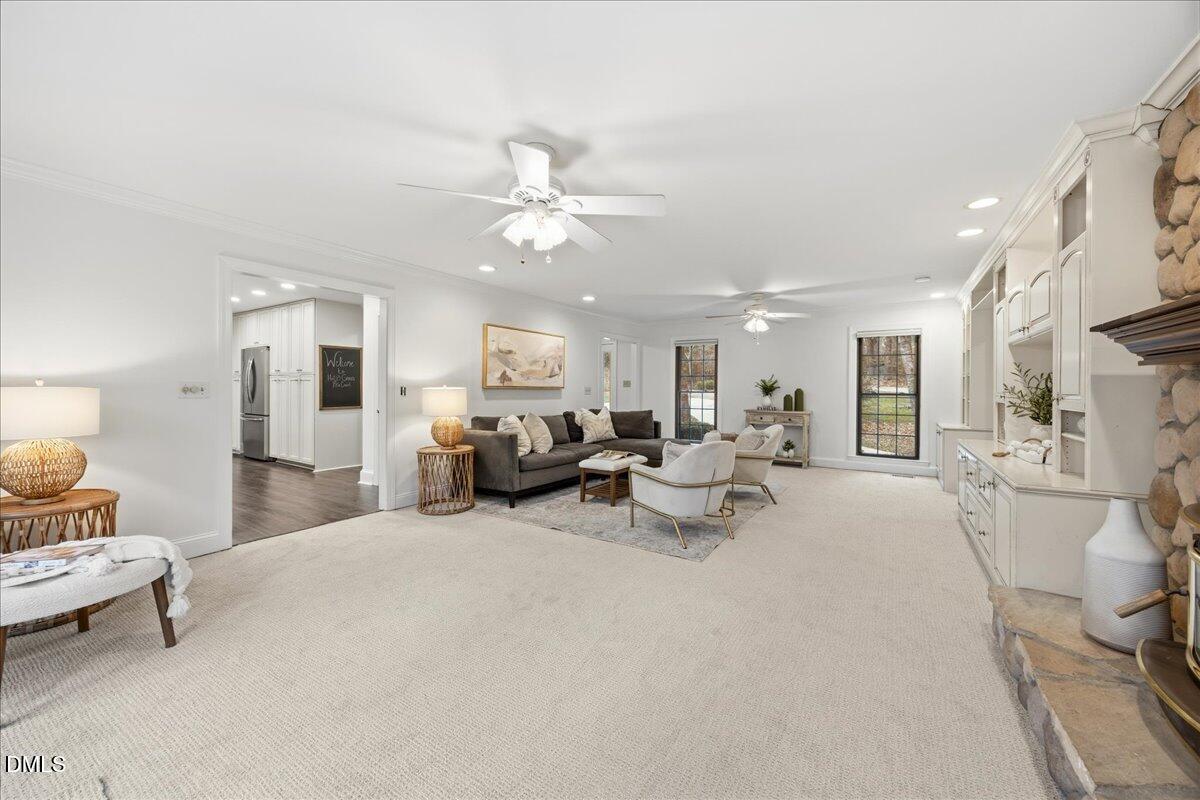 1603 Green Pine Court Raleigh, NC 27614 - Photo 26 of 70 a living room with furniture and a chandelier