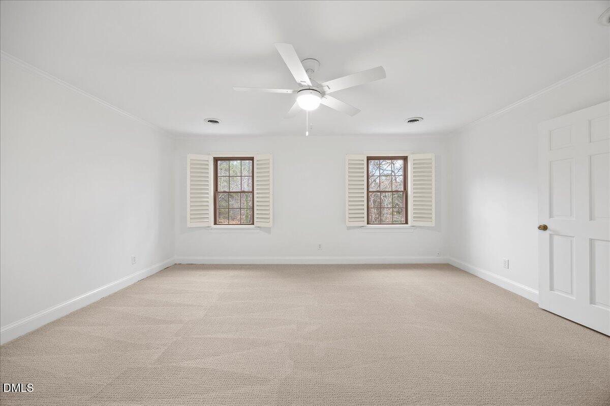 1603 Green Pine Court Raleigh, NC 27614 - Photo 40 of 70 an empty room with windows and ceiling fan