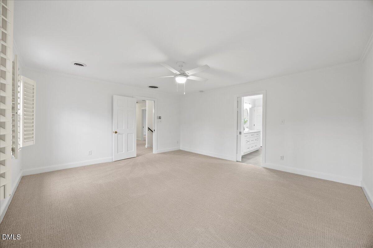 1603 Green Pine Court Raleigh, NC 27614 - Photo 41 of 70 an empty room with a ceiling fan and window