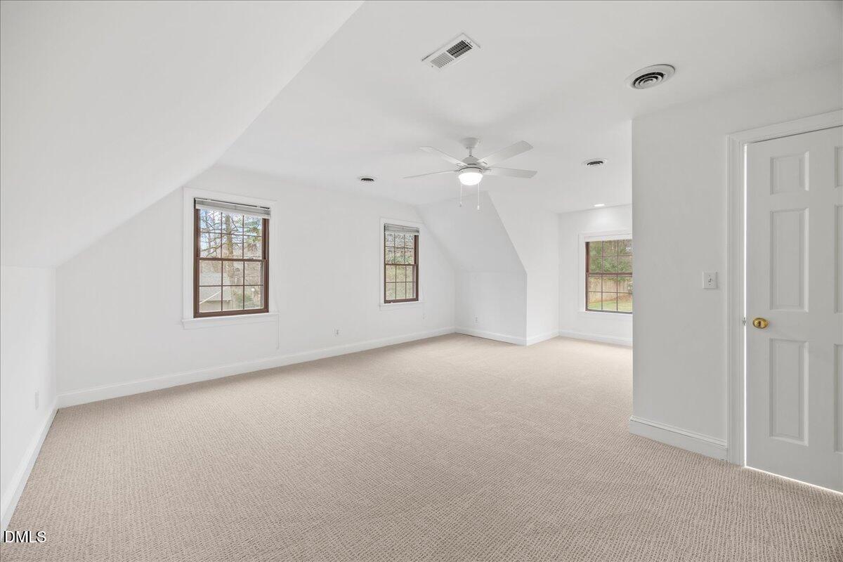 1603 Green Pine Court Raleigh, NC 27614 - Photo 47 of 70 an empty room with windows and ceiling fan