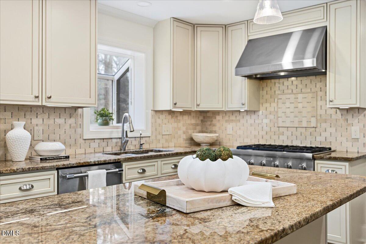 1603 Green Pine Court Raleigh, NC 27614 - Photo 5 of 70 a kitchen with granite countertop a sink a stove and cabinets