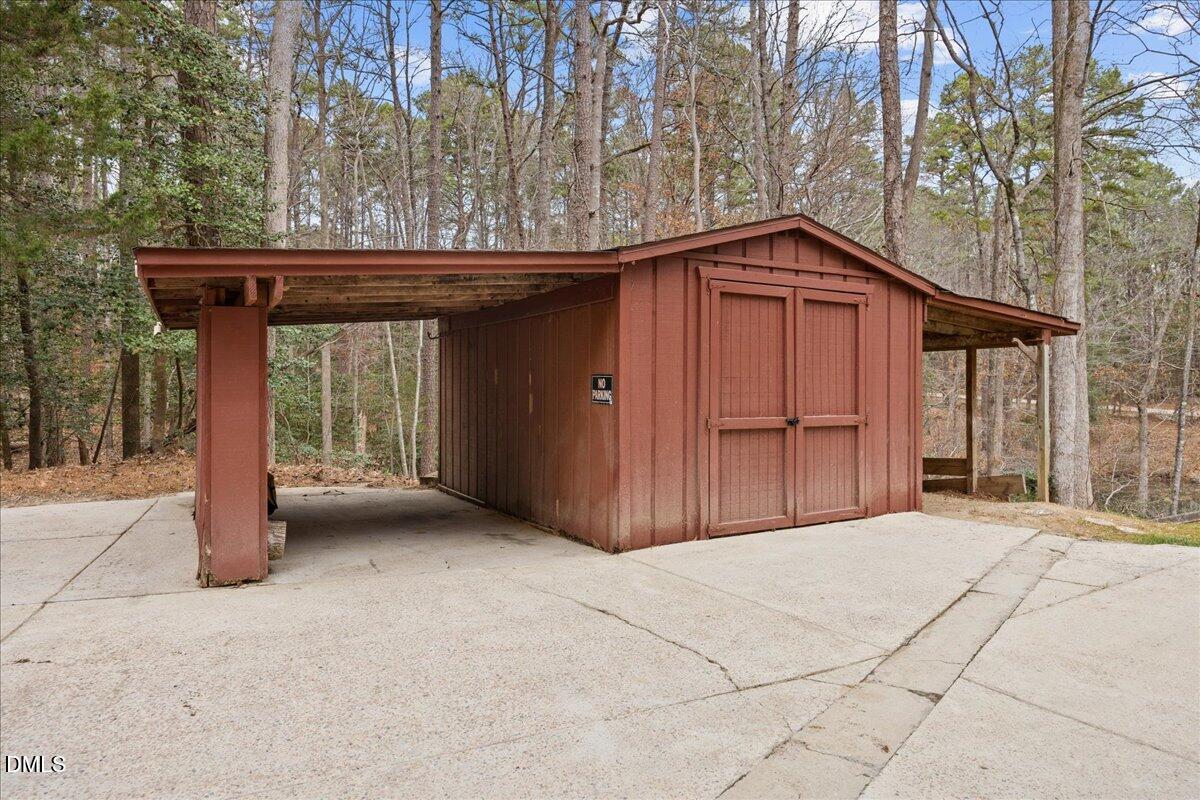 1603 Green Pine Court Raleigh, NC 27614 - Photo 60 of 70 a view of wooden house with a yard and garage