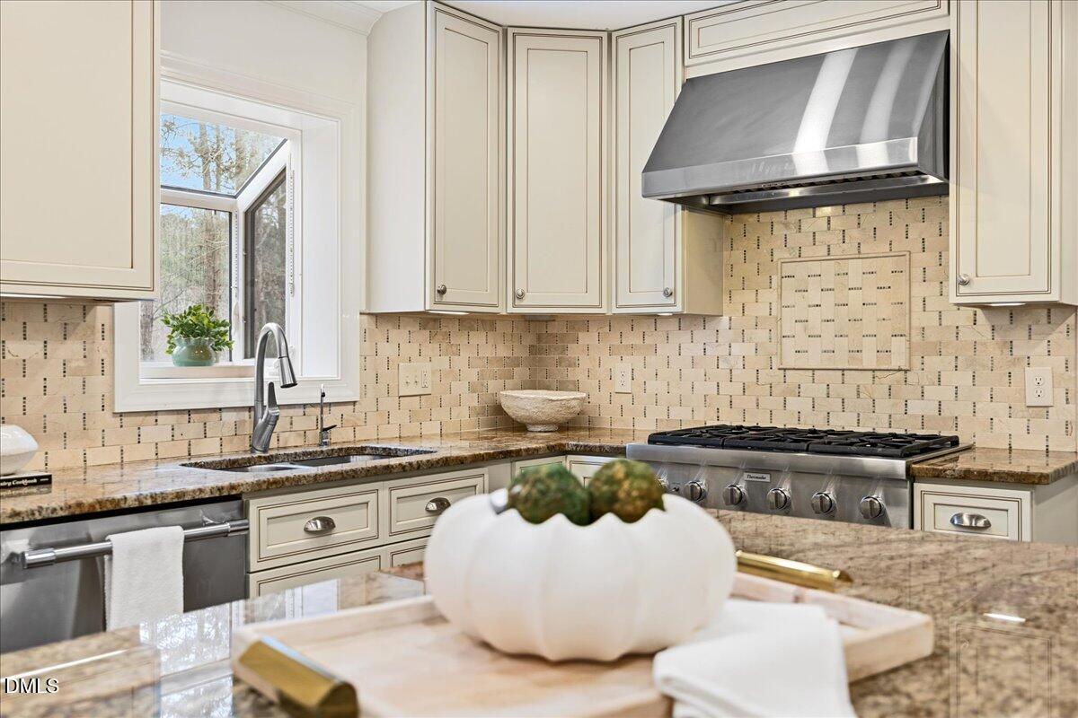 1603 Green Pine Court Raleigh, NC 27614 - Photo 10 of 70 a kitchen with a sink a stove and cabinets