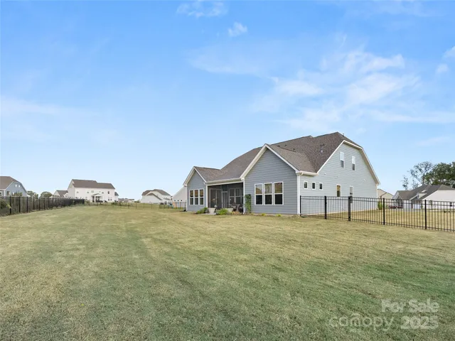 a big house with a big yard and large trees