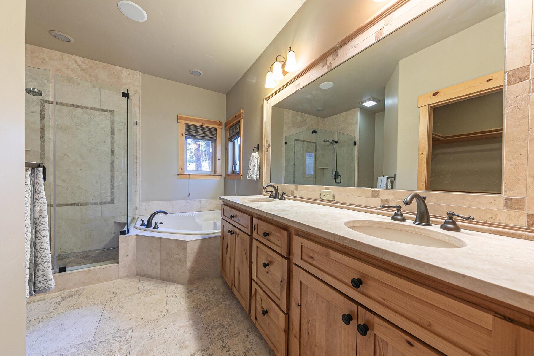 11707 Ski Slope Way Truckee, CA 96161 - Photo 17 of 28 a spacious bathroom with a double vanity sink mirror and bathtub