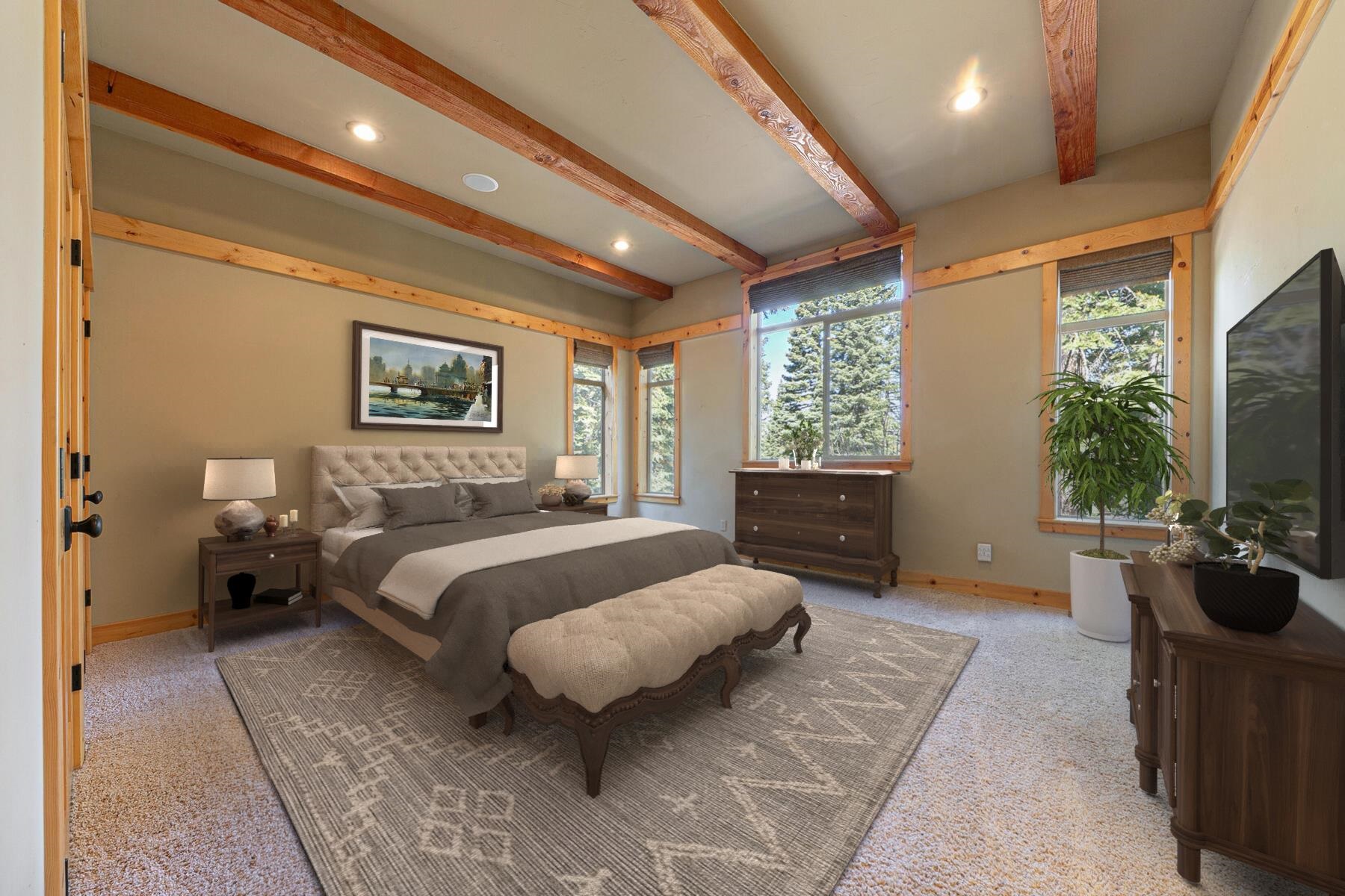 11707 Ski Slope Way Truckee, CA 96161 - Photo 20 of 28 a spacious bedroom with a bed a couch and large window