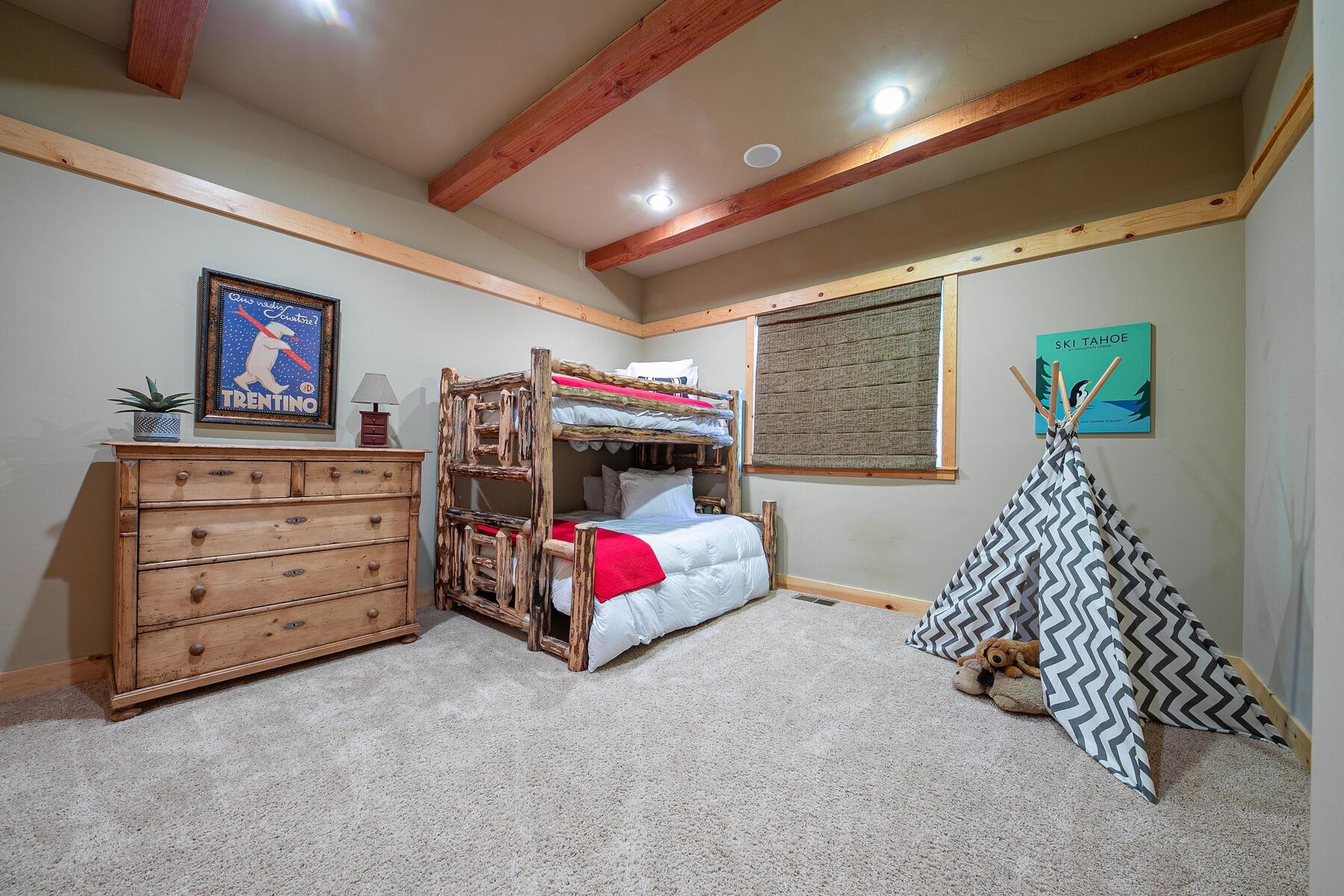 11707 Ski Slope Way Truckee, CA 96161 - Photo 22 of 28 a bed room with a bed and a couch