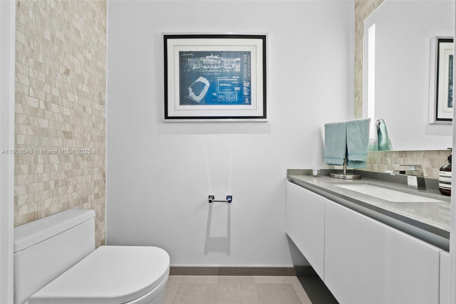 68 Southeast 6th Street, Unit 2505 Miami, FL 33131 - Photo 8 of 18 a bathroom with a granite countertop sink toilet and shower