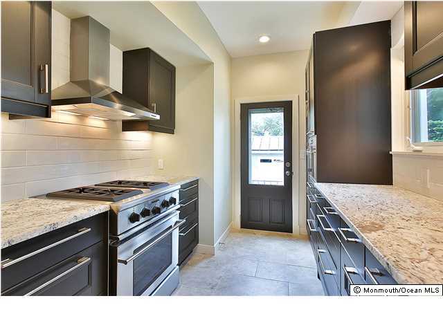 80 Black Point Road Rumson, NJ 07760 - Photo 2 of 11 a kitchen with a stove and a sink