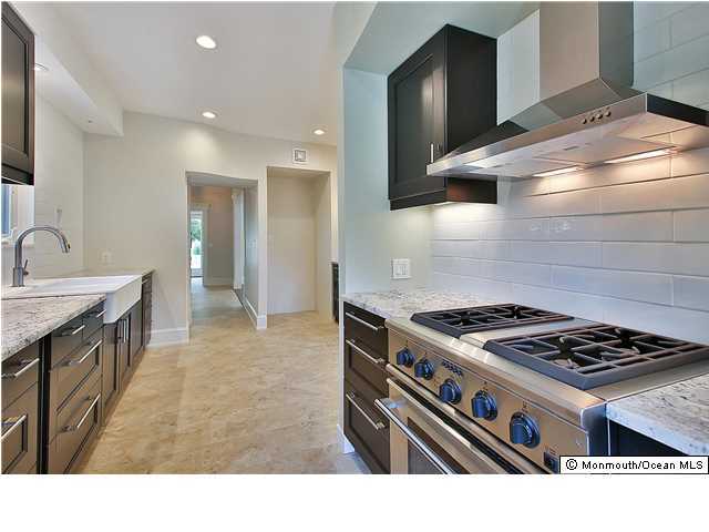 80 Black Point Road Rumson, NJ 07760 - Photo 3 of 11 a kitchen with a stove and a sink
