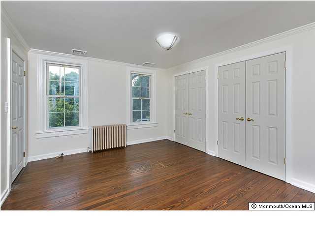 80 Black Point Road Rumson, NJ 07760 - Photo 9 of 11 a room with cabinet and windows