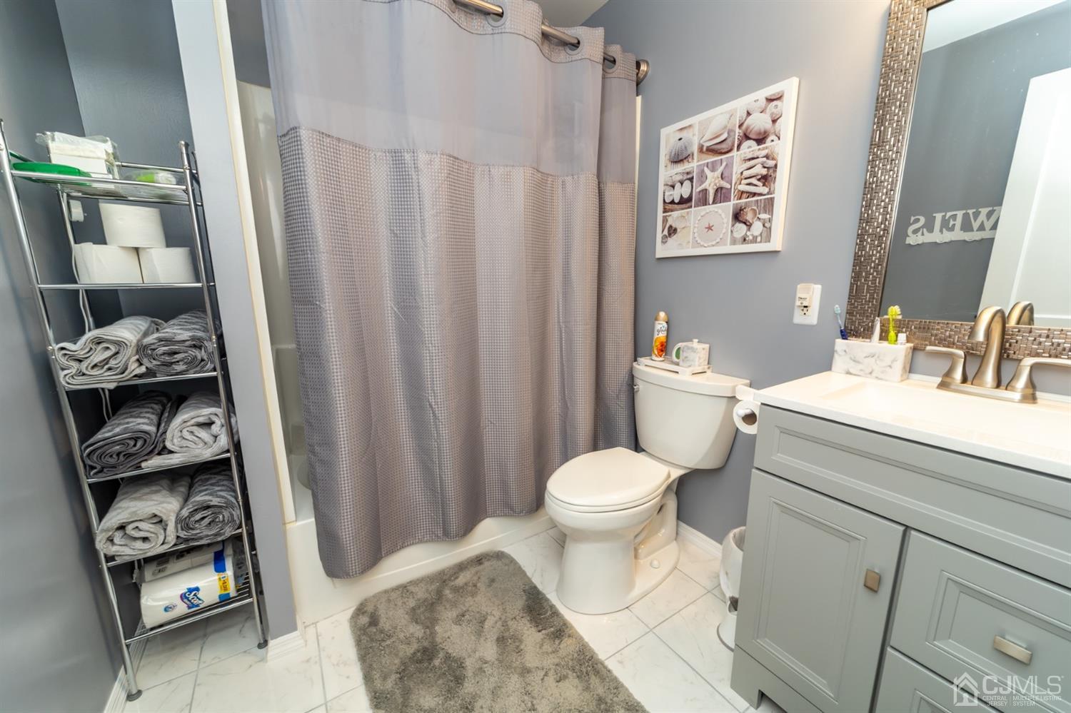 142 Weiss Terrace Raritan, NJ 08869 - Photo 13 of 29 a bathroom with a toilet a sink and a shower