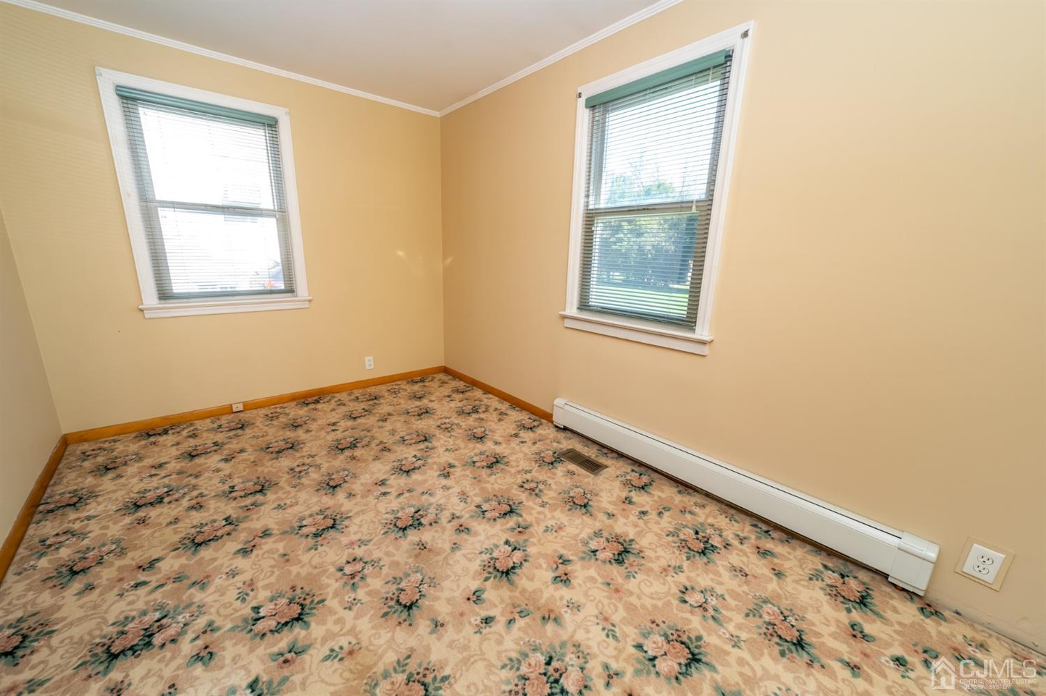 142 Weiss Terrace Raritan, NJ 08869 - Photo 14 of 29 a view of a big room with wooden floor and a window
