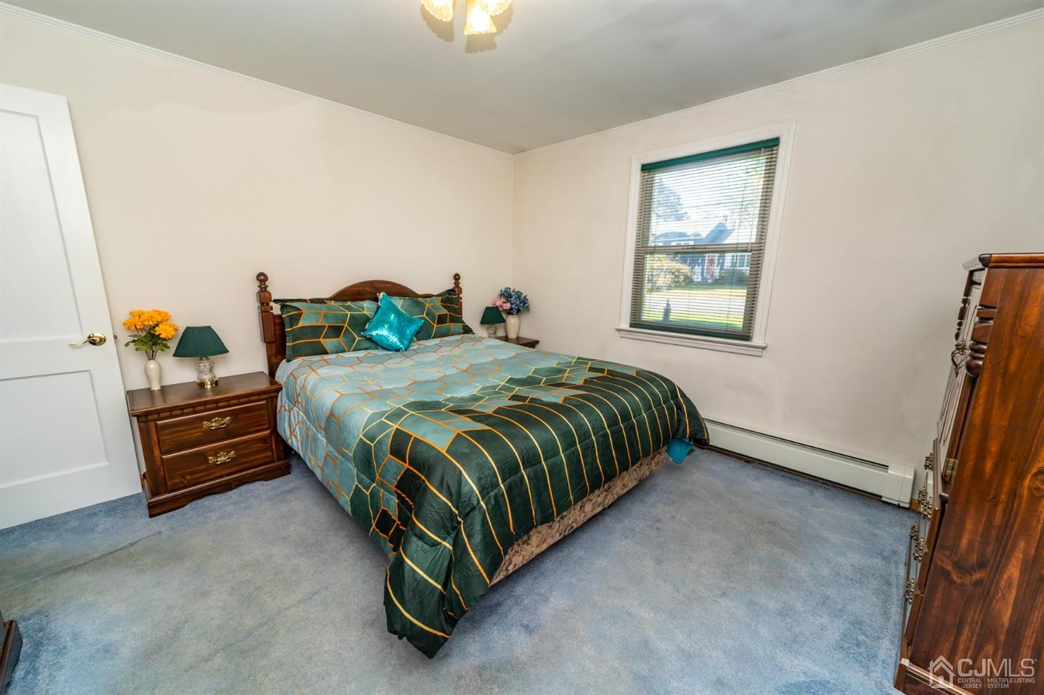 142 Weiss Terrace Raritan, NJ 08869 - Photo 17 of 29 a bedroom with a bed and a window