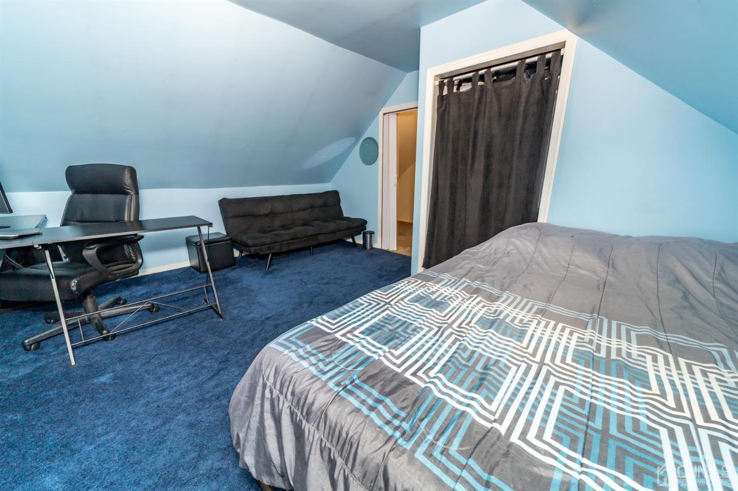 142 Weiss Terrace Raritan, NJ 08869 - Photo 19 of 29 a bedroom with a bed and a chair
