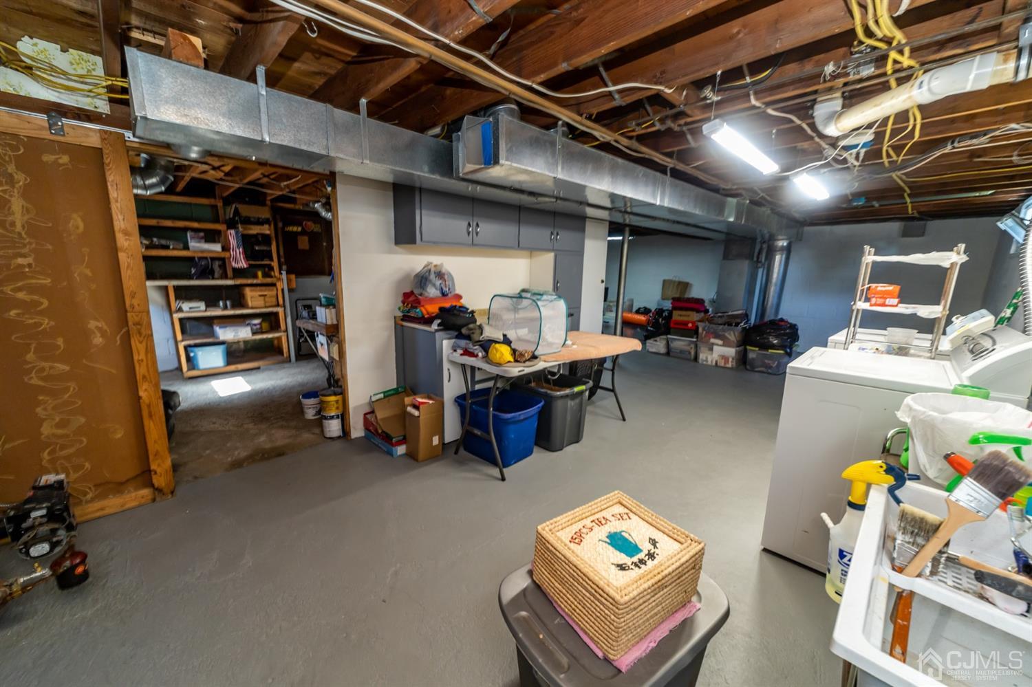 142 Weiss Terrace Raritan, NJ 08869 - Photo 22 of 29 a view of a storage room with racks the couch