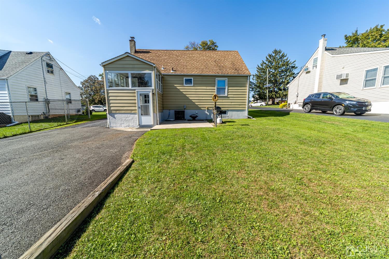 142 Weiss Terrace Raritan, NJ 08869 - Photo 24 of 29 a front view of a house with a garden and plants