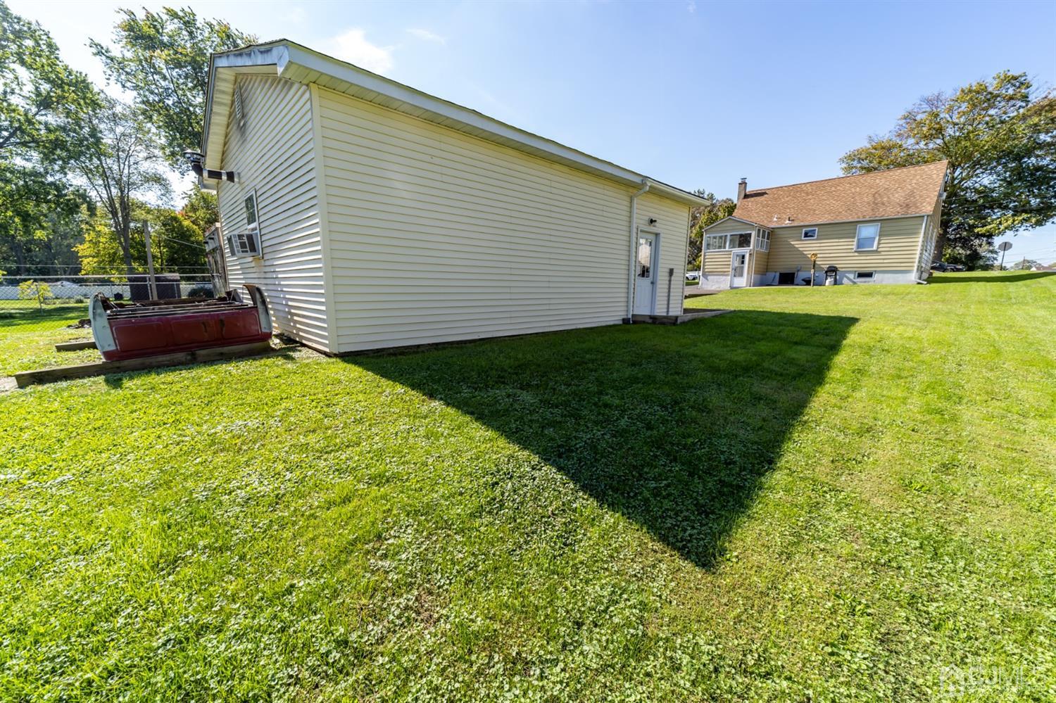142 Weiss Terrace Raritan, NJ 08869 - Photo 28 of 29 a view of backyard of house with green space