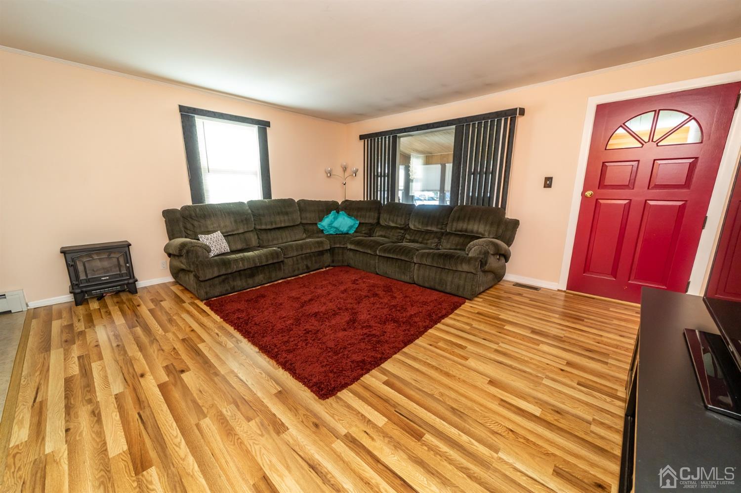 142 Weiss Terrace Raritan, NJ 08869 - Photo 7 of 29 a bedroom with a bed and wooden floor