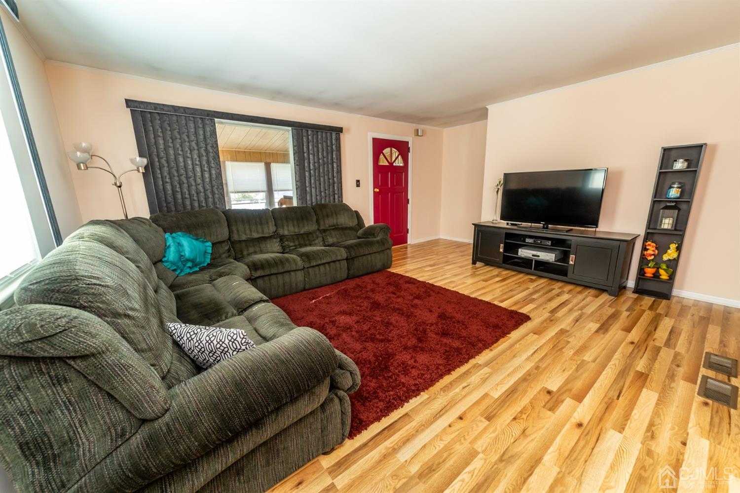 142 Weiss Terrace Raritan, NJ 08869 - Photo 9 of 29 a living room with furniture and a flat screen tv