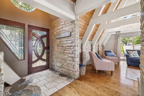 a view of a dining room with furniture and window
