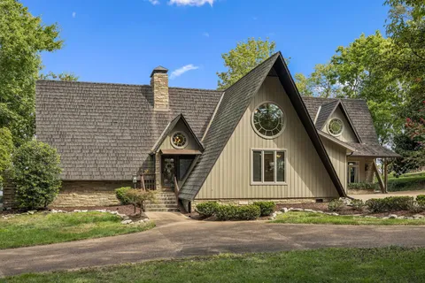 a view of backyard with wheel chair and potted plants